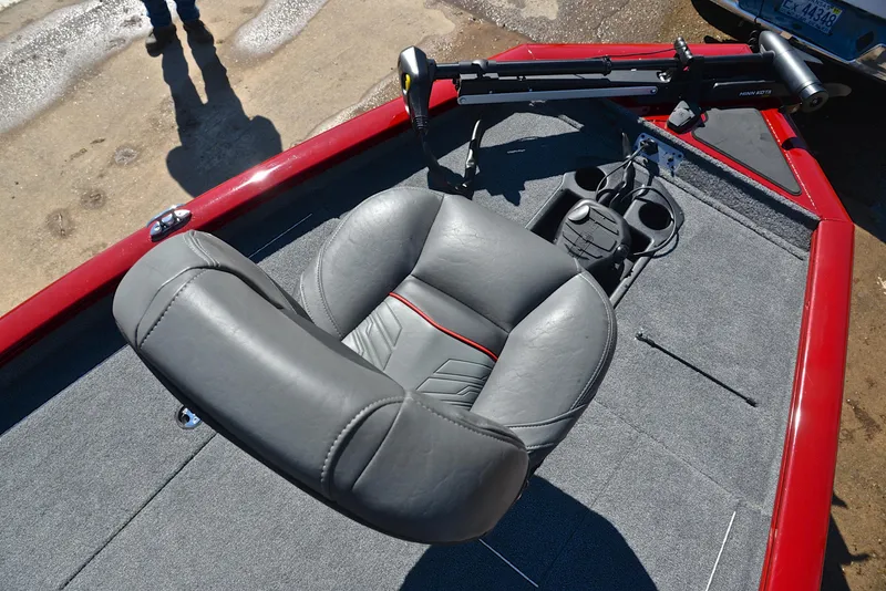 Slide: The Image of 2021 Tracker 175 TXW boat interior with gray seat and red trim. - 24