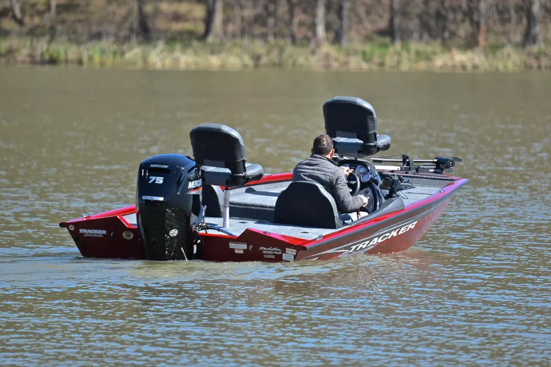 Slide: The Image of 2021 Tracker 175 TXW boat on a lake, featuring a Mercury 75 engine. - 8