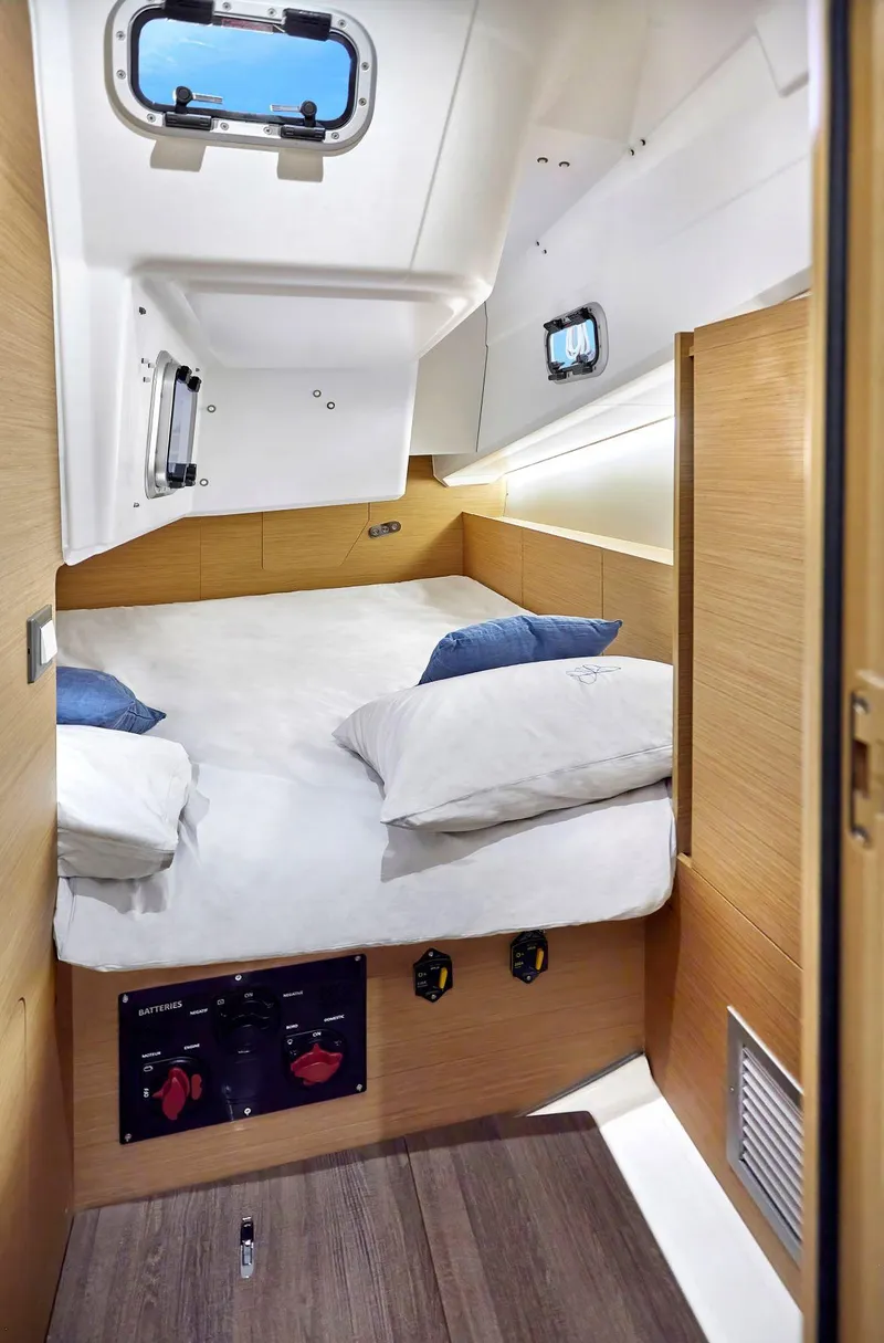 Slide: The Image of Cozy cabin interior of 2023 Jeanneau Sun Odyssey 380 sailboat with modern design. - 19