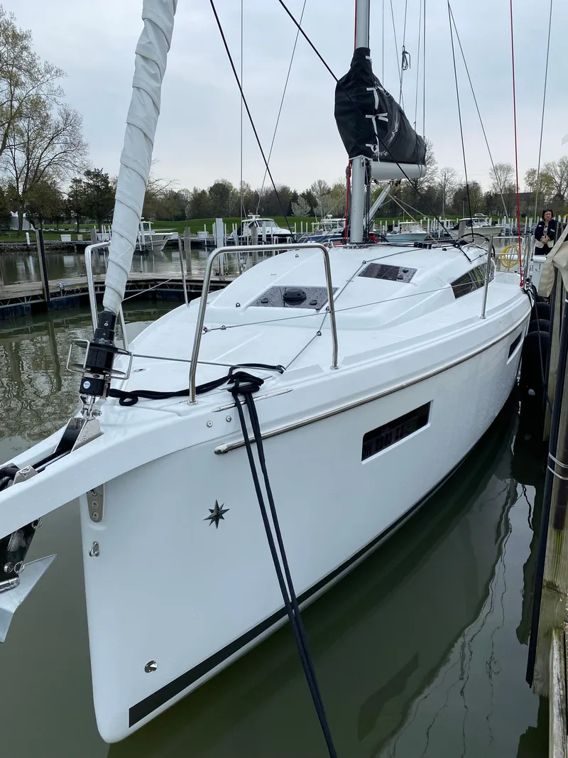 Slide: The Image of 2023 Jeanneau Sun Odyssey 380 sailboat docked in a marina. - 4