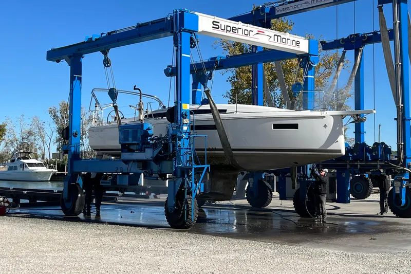 Slide: The Image of 2023 Jeanneau Sun Odyssey 380 sailboat lifted by Superior Marine crane. - 7