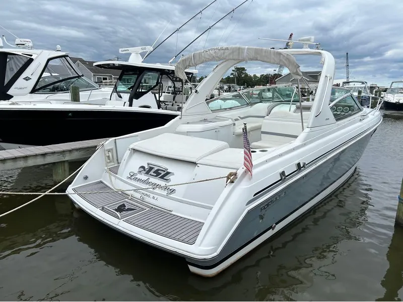 The Image of 2004 Formula 330 SS boat docked at a marina. - 1