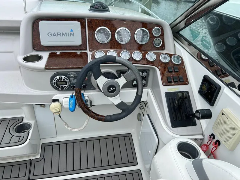 Slide: The Image of 2004 Formula 330 SS boat dashboard with Garmin navigation system and control panel. - 3
