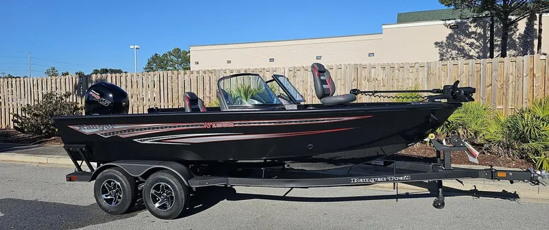 The Image of 2023 Ranger VS1882SC Angler boat on a trailer in a parking lot. - 0