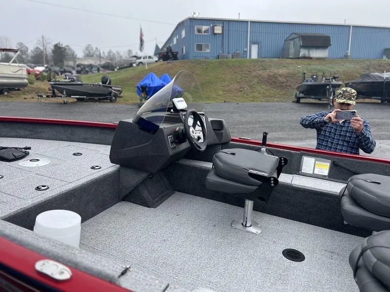 Slide: The Image of 2023 Tracker Pro Guide™ V-16 SC fishing boat interior with steering console and seating. - 5