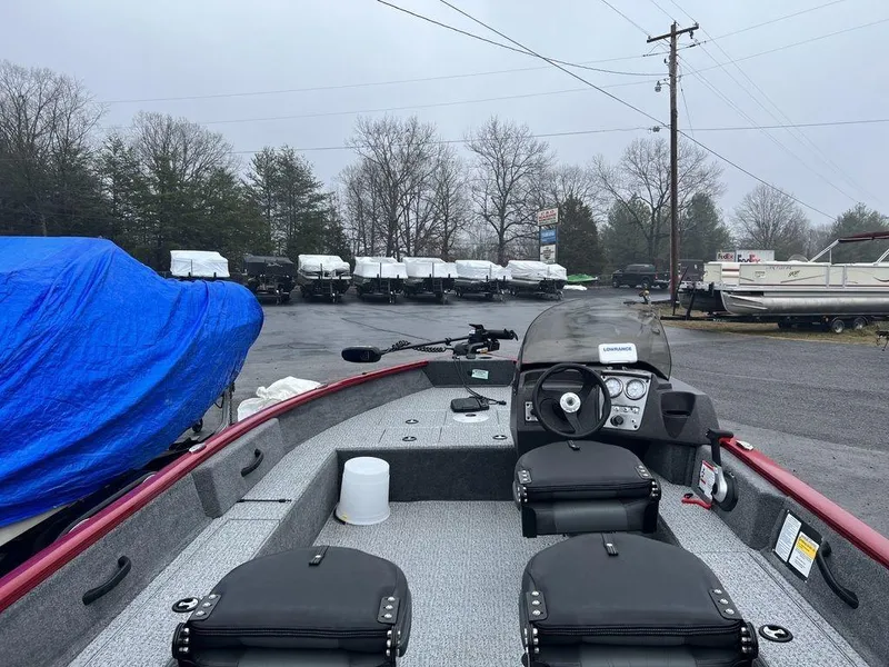 Slide: The Image of 2023 Tracker Pro Guide™ V-16 SC fishing boat in a dealership lot. - 7