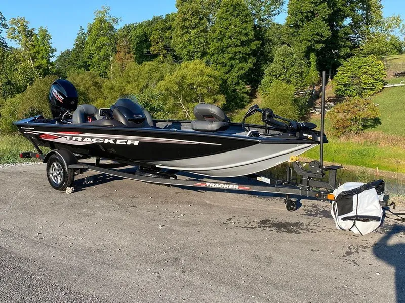 The Image of 2023 Tracker Pro Team 175 TXW® fishing boat on trailer in outdoor setting. - 1