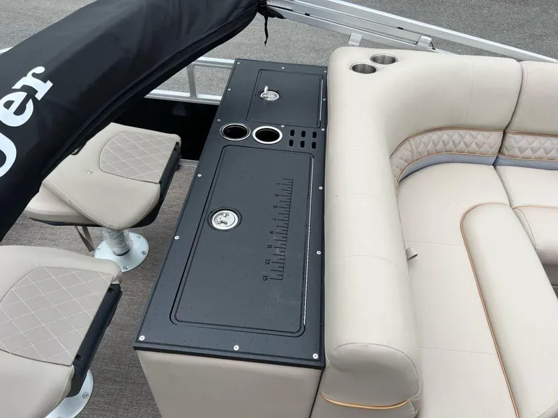 Slide: The Image of 2023 Ranger 223FC boat interior with seating and console. - 11