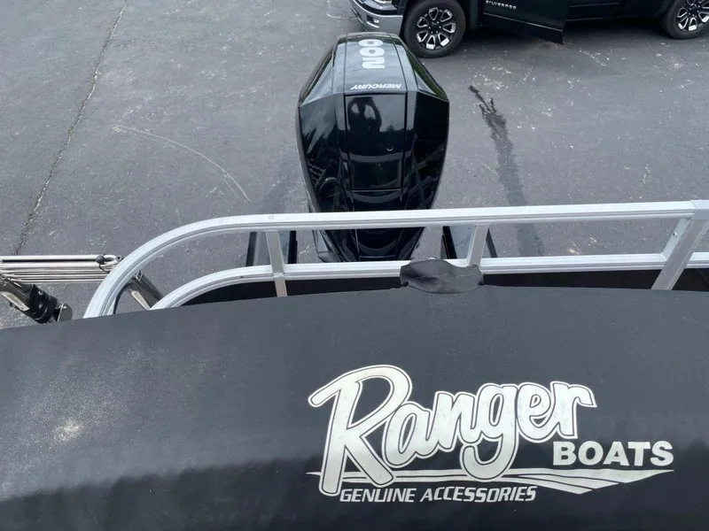 Slide: The Image of 2023 Ranger 223FC boat with Mercury outboard motor and Ranger Boats cover. - 2