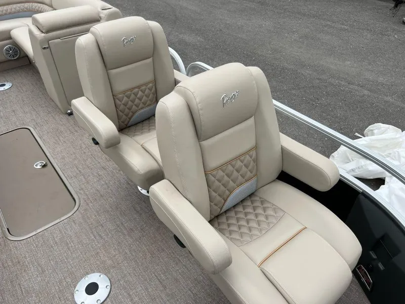 Slide: The Image of 2023 Ranger 223FC boat with beige leather seats and diamond stitching. - 8