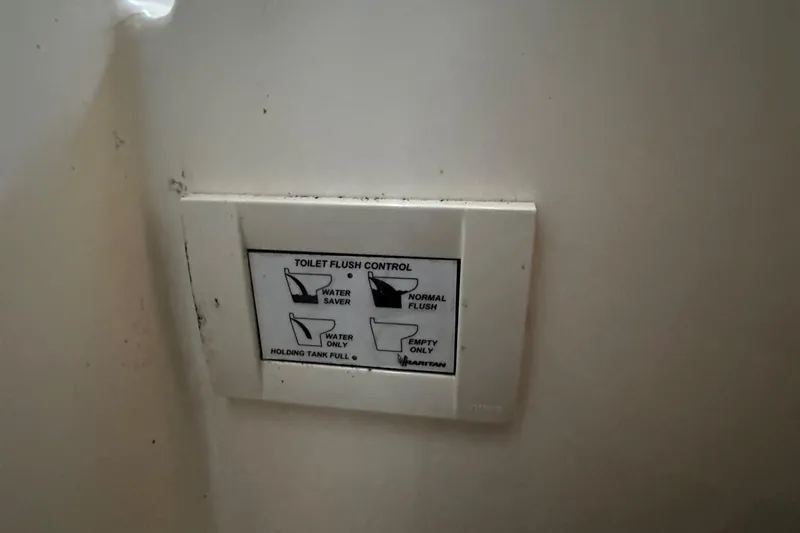 Slide: The Image of 1980 Bertram 33 Sport Fisherman toilet flush control panel - 13