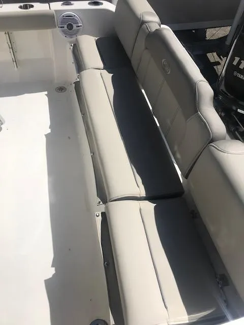 Slide: The Image of 2024 Key West 189 FS boat with cushioned seating and clean white deck. - 13