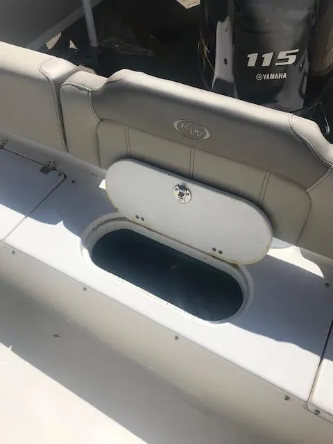 Slide: The Image of 2024 Key West 189 FS boat with Yamaha 115 engine, open storage compartment. - 15