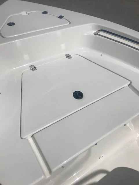 Slide: The Image of 2024 Key West 189 FS boat deck with storage compartments. - 8