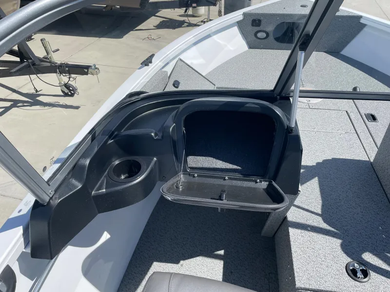Slide: The Image of 2022 Crestliner 1700 Vision boat interior with open storage compartment. - 14