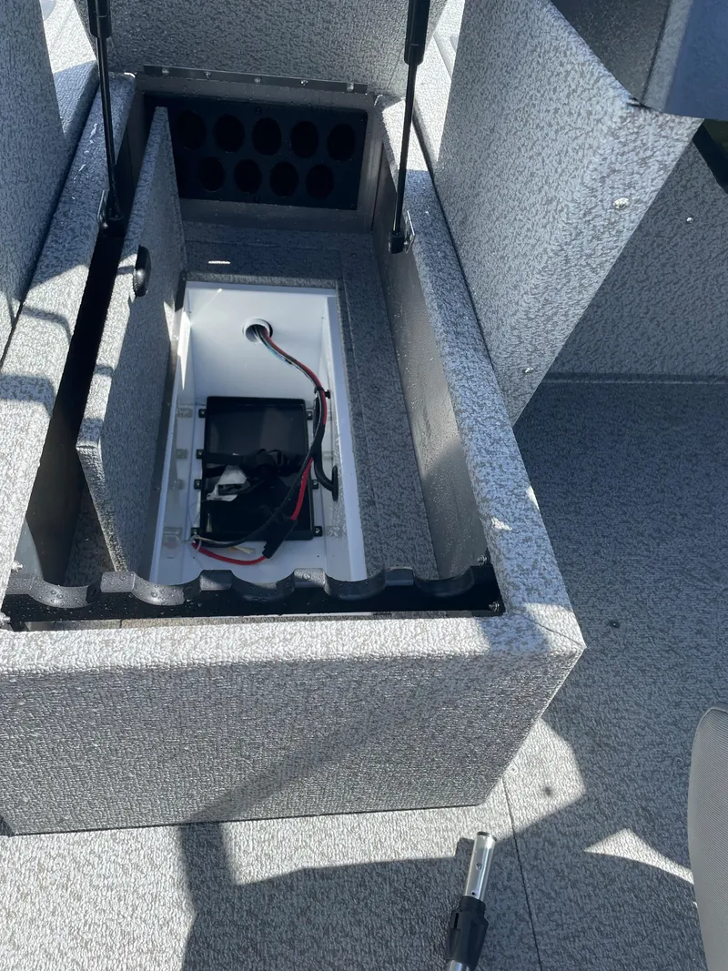 Slide: The Image of 2022 Crestliner 1700 Vision boat storage compartment with battery and wiring. - 17