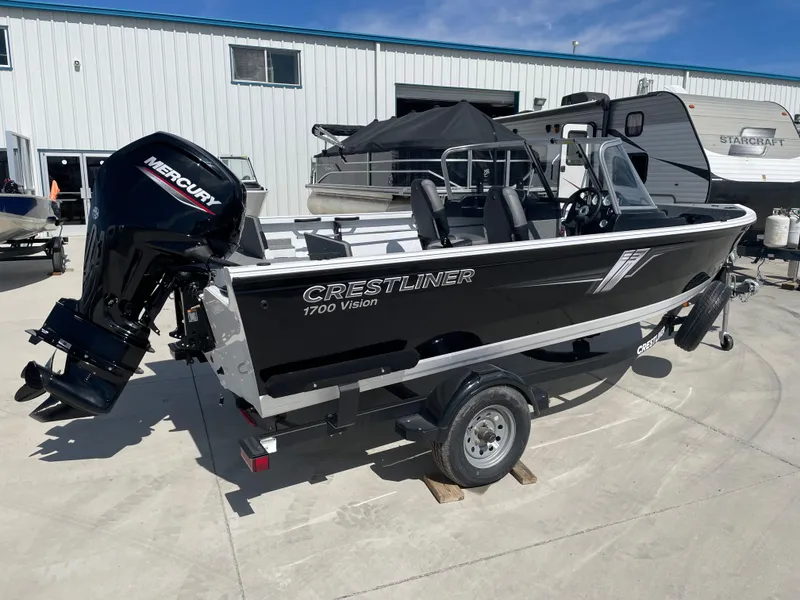 Slide: The Image of 2022 Crestliner 1700 Vision boat with Mercury outboard motor on trailer. - 3