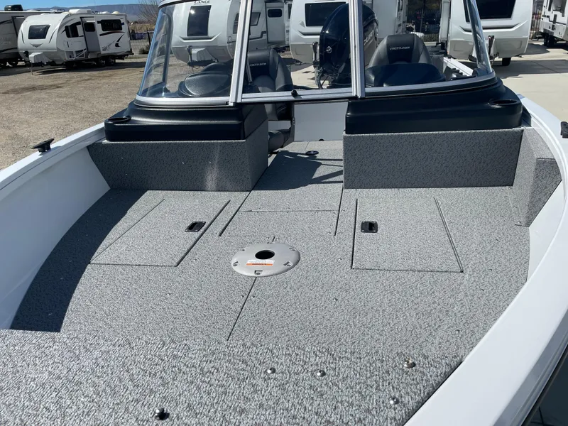 Slide: The Image of 2022 Crestliner 1700 Vision boat with spacious deck and windshield. - 6