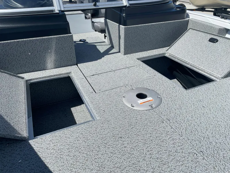 Slide: The Image of 2022 Crestliner 1700 Vision boat interior with open storage compartments. - 7