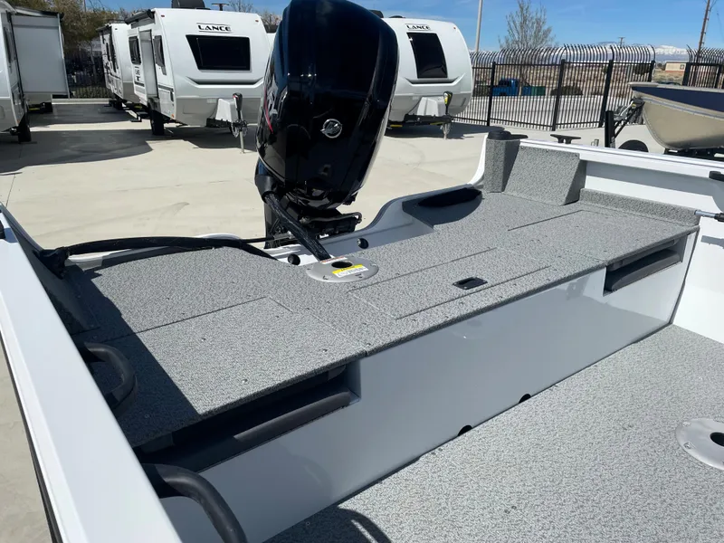 Slide: The Image of 2022 Crestliner 1700 Vision boat with motor, parked near RVs. - 9