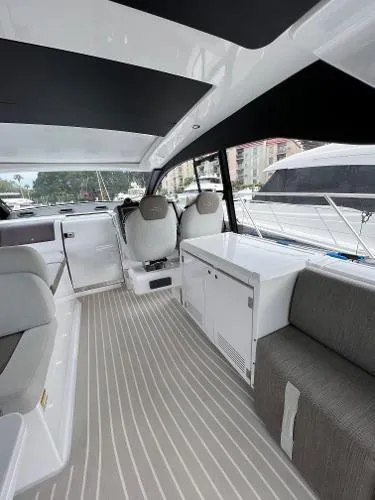 Slide: The Image of Interior of 2019 Azimut 51 Atlantis Coupe yacht with modern seating and sleek design. - 16