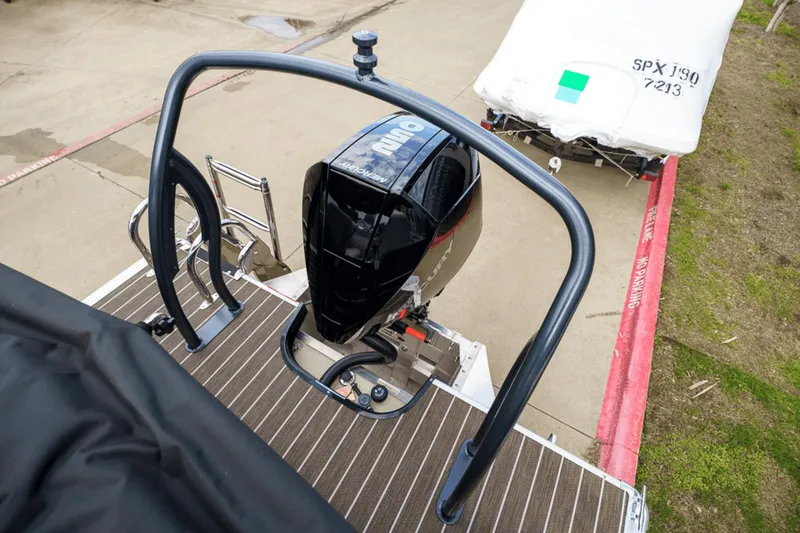 Slide: The Image of 2023 Premier 230 Solaris boat with powerful outboard motor, docked on a wooden platform. - 35