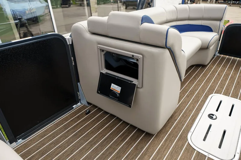 Slide: The Image of 2023 Premier 230 Solaris boat interior with beige seating and striped flooring. - 15