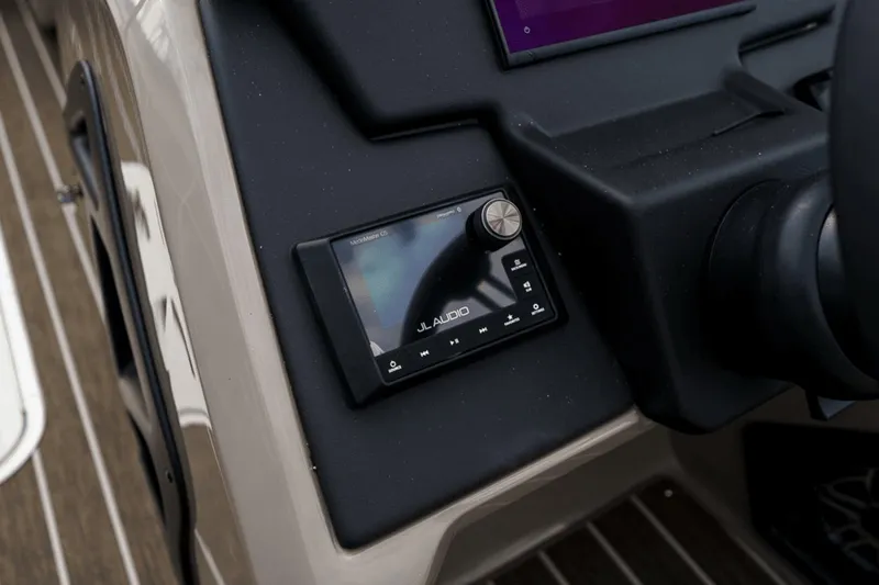 Slide: The Image of Control panel of 2023 Premier 230 Solaris boat featuring JL Audio system. - 19
