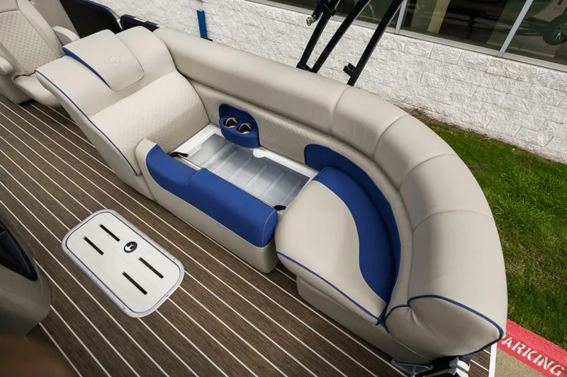 Slide: The Image of Luxurious seating on 2023 Premier 230 Solaris boat with beige and blue upholstery. - 14