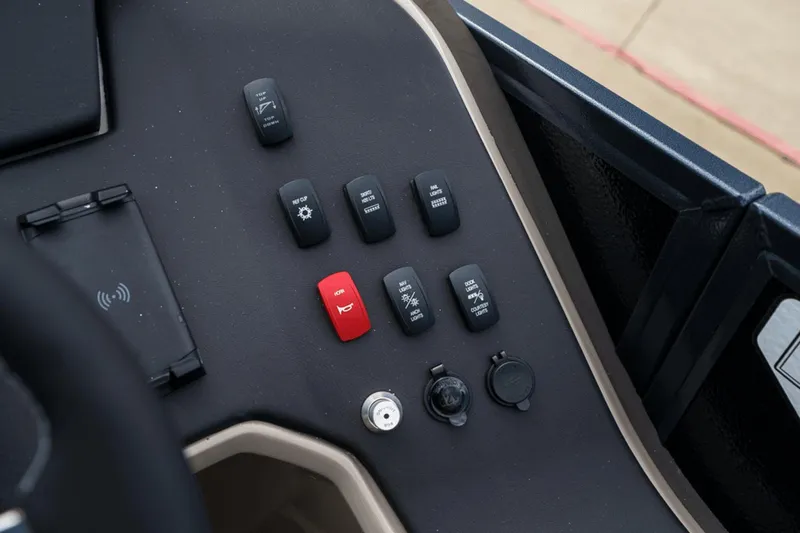 Slide: The Image of Control panel of 2023 Premier 230 Solaris boat with various switches and buttons. - 22