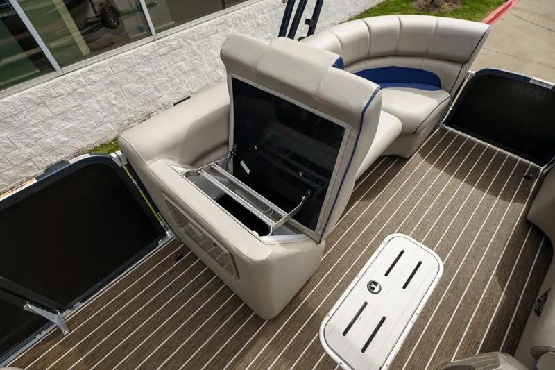 Slide: The Image of 2023 Premier 230 Solaris boat interior with beige seating and striped flooring. - 13