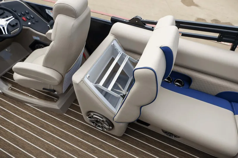Slide: The Image of 2023 Premier 230 Solaris boat interior with beige seating and storage compartment. - 33