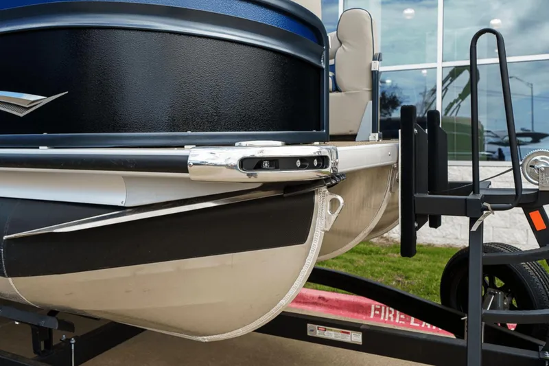 Slide: The Image of 2023 Premier 230 Solaris pontoon boat on trailer, close-up view of front section. - 36