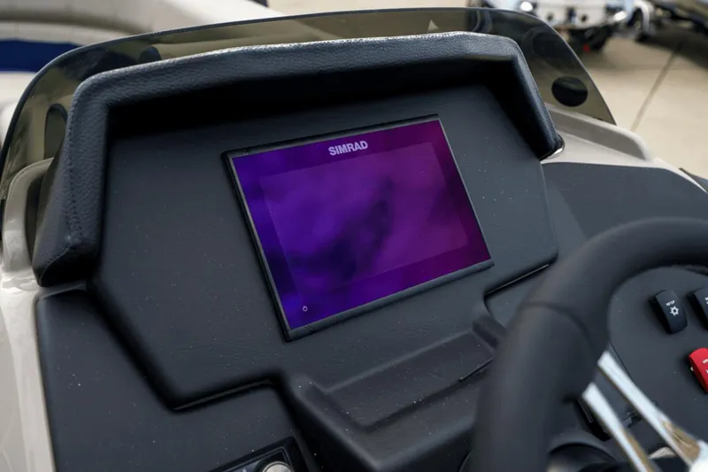 Slide: The Image of 2023 Premier 230 Solaris dashboard with Simrad display and steering wheel. - 20