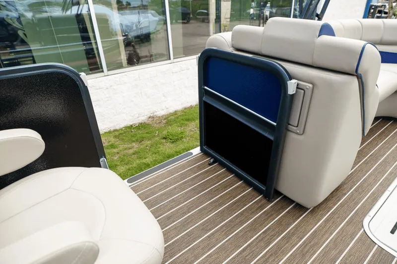 Slide: The Image of 2023 Premier 230 Solaris boat interior with beige seating and striped flooring. - 16