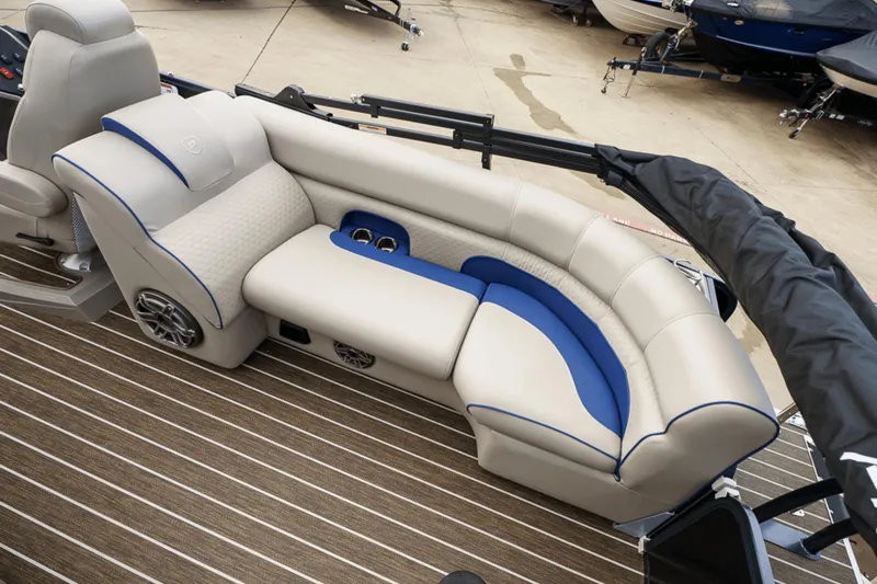 Slide: The Image of Luxurious seating on 2023 Premier 230 Solaris pontoon boat with beige and blue accents. - 29