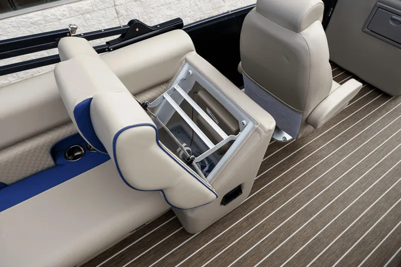 Slide: The Image of 2023 Premier 230 Solaris boat interior with beige seating and striped flooring. - 28