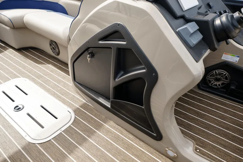 Slide: The Image of 2023 Premier 230 Solaris boat interior with storage compartment and seating. - 17