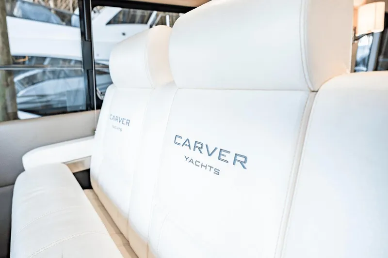 Slide: The Image of Luxurious white seating on 2017 Carver 52 Command Bridge yacht interior. - 20