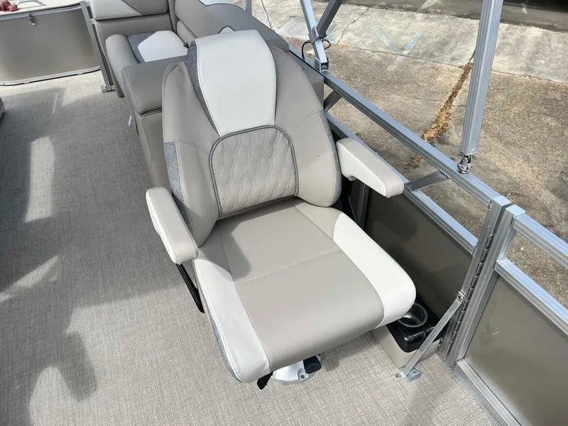 Slide: The Image of 2023 Avalon 2380 Venture Quad Lounger boat interior with comfortable seating. - 12
