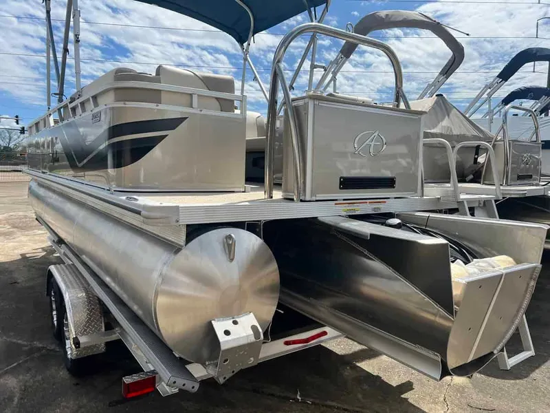 Slide: The Image of 2023 Avalon 2380 Venture Quad Lounger pontoon boat on trailer, rear view. - 4