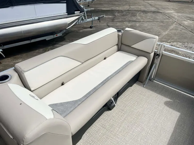 Slide: The Image of 2023 Avalon 2380 Venture Quad Lounger interior with beige seating. - 6