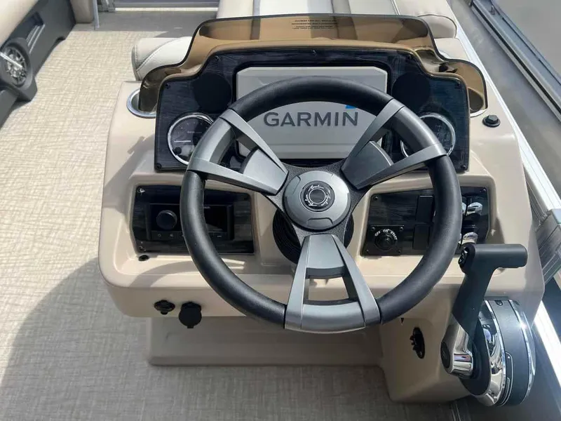 Slide: The Image of 2023 Avalon 2380 Venture Quad Lounger boat dashboard with Garmin navigation system. - 9