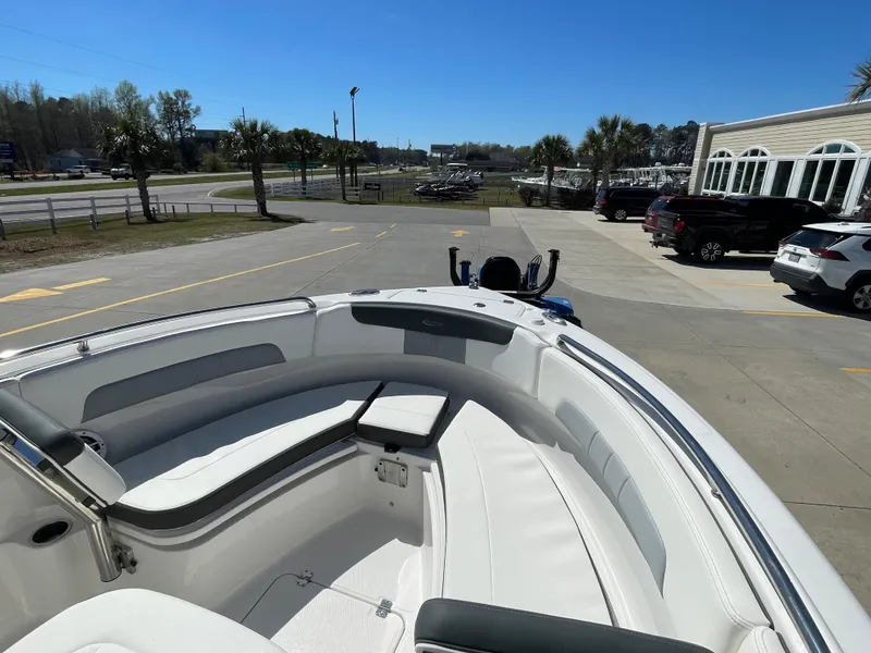 Slide: The Image of 2024 Robalo R222 Center Console boat with spacious seating and modern design. - 15