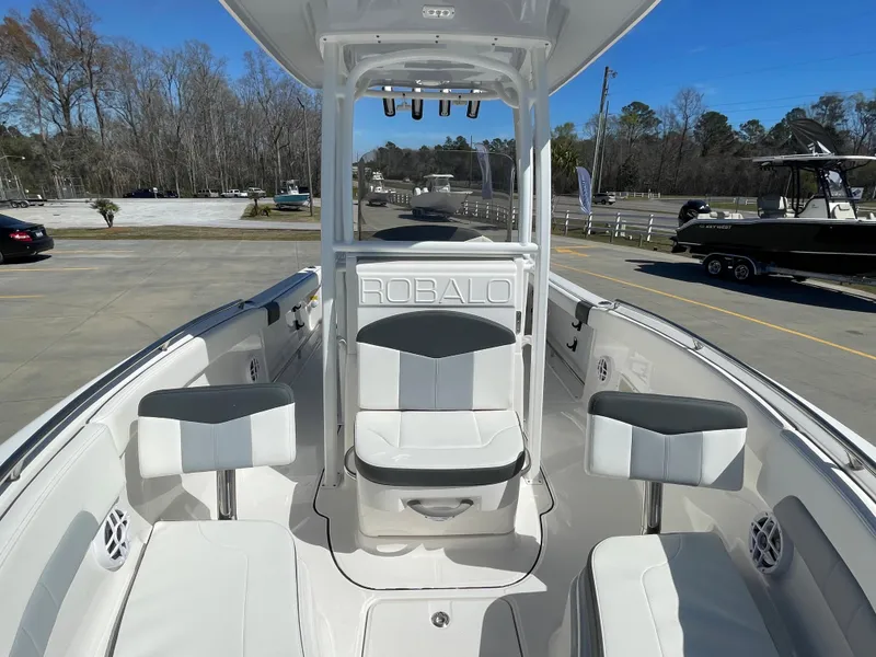 Slide: The Image of 2024 Robalo R222 Explorer boat interior with seating and console. - 16