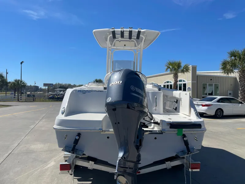 Slide: The Image of 2024 Robalo R222 Explorer boat with Yamaha 200 engine, rear view. - 2