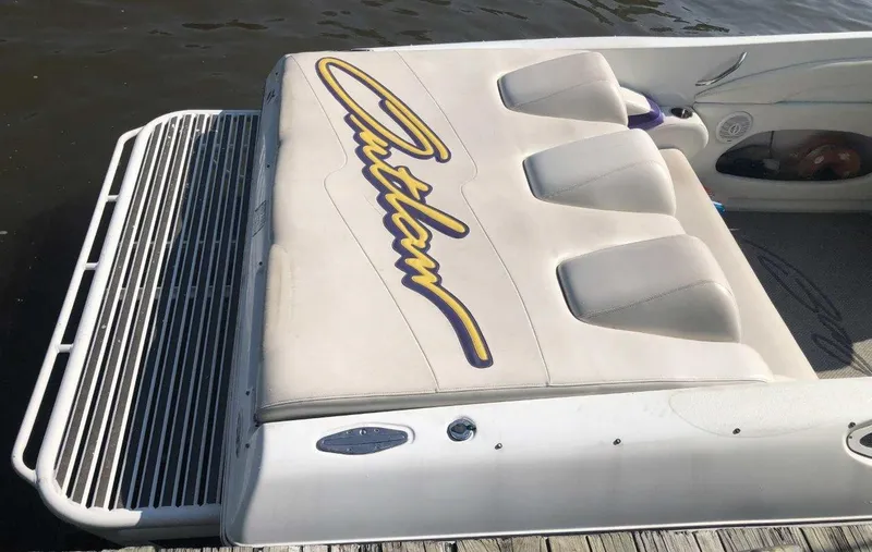 Slide: The Image of 1999 Baja 33 Outlaw boat with custom seating and swim platform. - 18