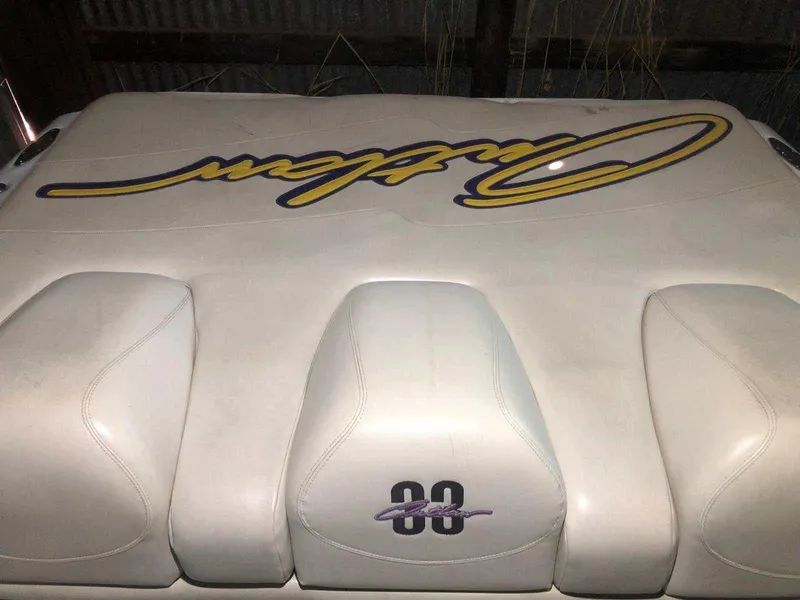 Slide: The Image of 1999 Baja 33 Outlaw boat seat with logo and number 33. - 20