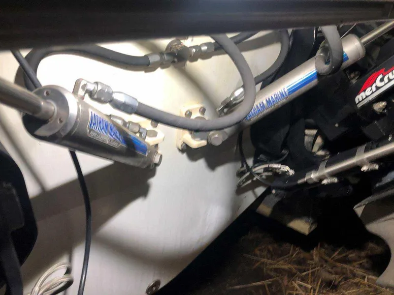 Slide: The Image of Close-up of hydraulic components on a 1999 Baja 33 Outlaw boat. - 35