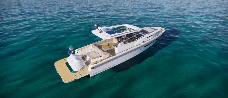 Slide: The Image of 2024 Nimbus W11 luxury yacht on clear blue water. - 15